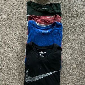 Four men’s size small short sleeve t-shirts. Nike, American Eagle, Aeropostale